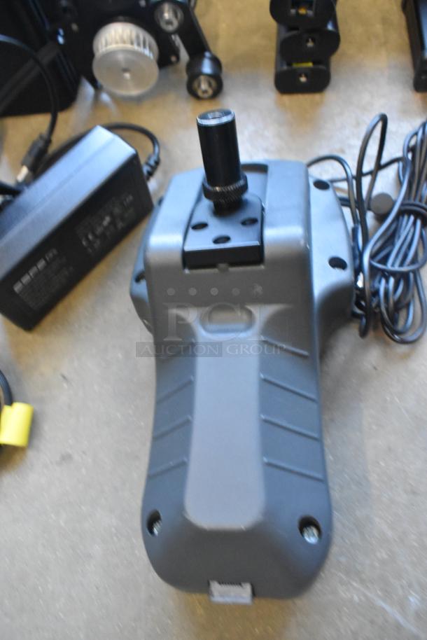 Lot of Ditogear equipment: unit, 3 modules, 2 LensDrives, Sony controller. Includes cables and hard case. Good condition.