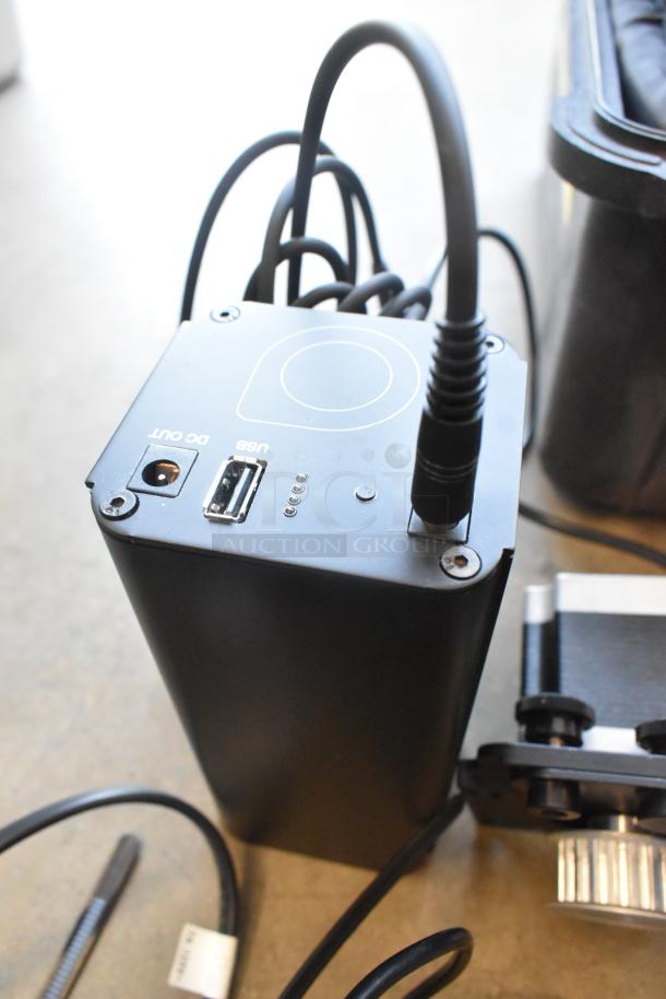 Ditogear unit with connected cables, USB, and DC out ports. Includes Ditogear modules, LensDrives, and Sony controller in hard case.