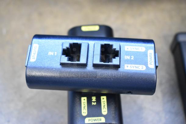 Ditogear module with input/output ports, labeled "IN1," "IN2," "SYNC1," "SYNC2," and "POWER." 