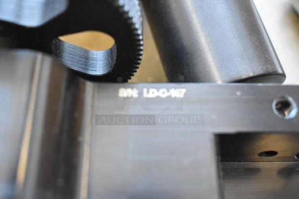 Ditogear module with serial number LD-C-147, featuring precision gear, black finish, in excellent condition.