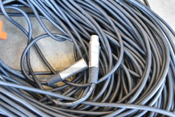 Lot of 3-pin XLR and component video cables in poly bin, includes multiple black cables, some with visible connectors.