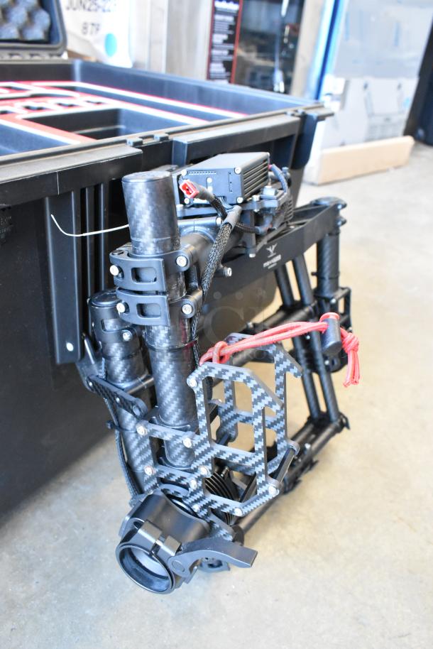 Freefly Mavi M10 gimbal, model M10B22910, full cage design, carbon fiber structure, excellent condition, with red cord handle.