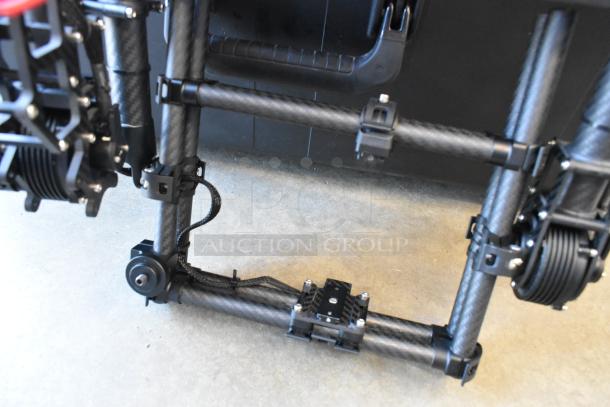 Freefly Mavi M10 M10B22910 full cage gimbal, carbon fiber, excellent condition, visible mounting brackets.
