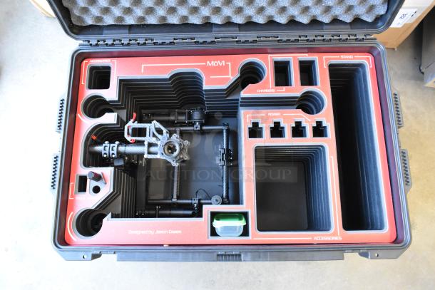 Freefly Mavi M10 gimbal in customized foam case, organized compartments labeled for accessories, chargers, and power.