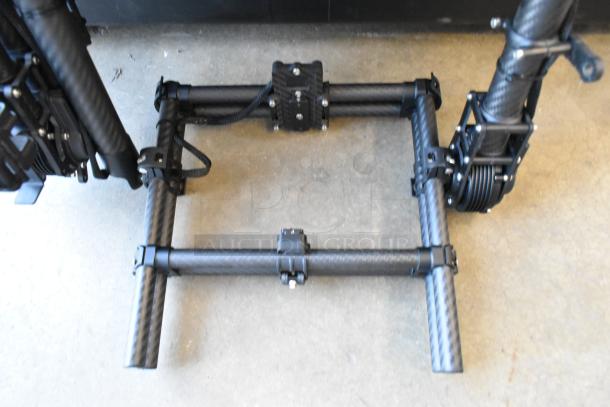 Freefly Mavi M10 gimbal, model M10B22910, full cage setup, carbon fiber frame, excellent condition, robust build.