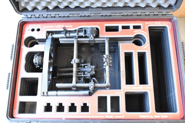 Freefly Mavi M10 gimbal, model M10B22910, in a protective case. Features full cage design, organized compartments.