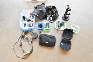 Lot of various items in a poly bin including GoPro accessories, wires, poly containers, and a Chesly GoPro chest mount.