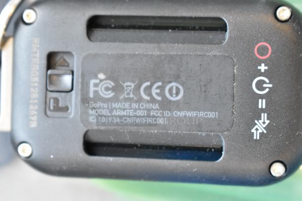 GoPro Model ARMT-001, made in China, with FCC ID: CNFWIFIRC001, shown in close-up.