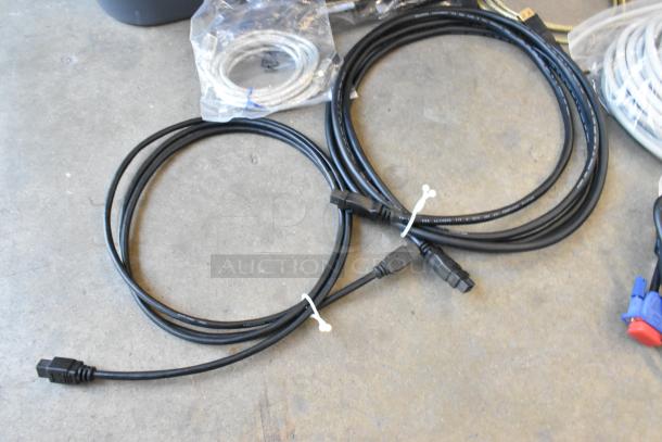 Various wires in a poly bin, includes black, coiled cables with connectors; condition appears good.