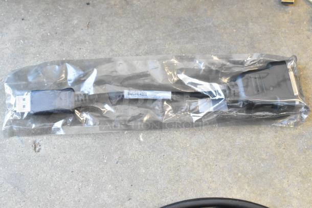 Lot of wires in poly bin, including a BizLink 4208 cable in sealed packaging, various connectors visible.