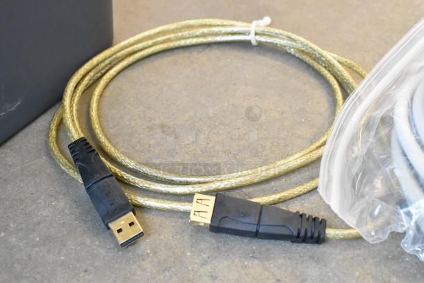 Poly bin with various items, including a gold USB cable. Cable appears in good condition, bundled with other items.