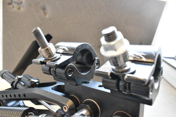 Flowcine Black Mount with visible wear, featuring durable construction and metal bolts, shown inside a protective hard case.