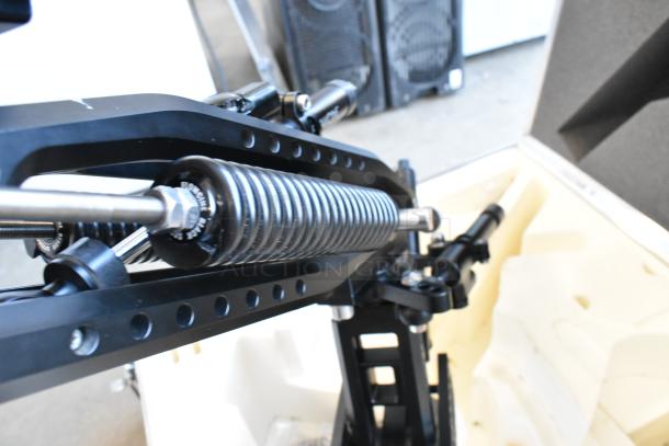 Flowcine Black Mount with spring mechanism, in excellent condition, housed in a custom hard case.