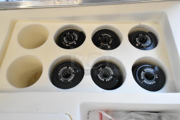 Flowcine Black Mount in hard case with labeled springs 7.5, 7.0, and 1.5. Custom foam slots for secure storage.
