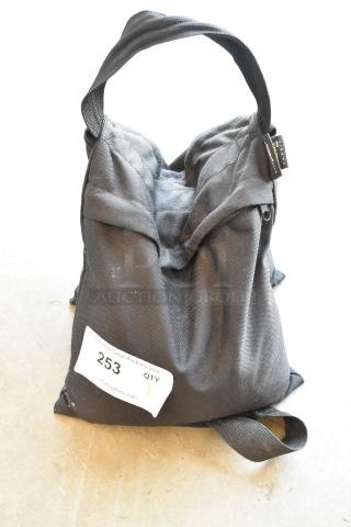 Impact SBF-B-25 Sandbag, black, double-layered with sturdy handle. Auction tag 253 attached, showing minimal wear.