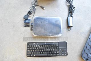 Logitech Revue media player with keyboard and cables, minor wear, includes power adapter and USB cable.