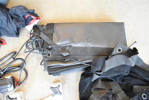 Lot of various items including a square stock metal holder for fabric in a poly bin, cords, and straps; used condition.