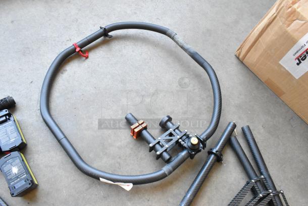 Movi Ring with attached batteries and additional parts; used condition, durable build with metal connectors, suitable for gimbal setups.