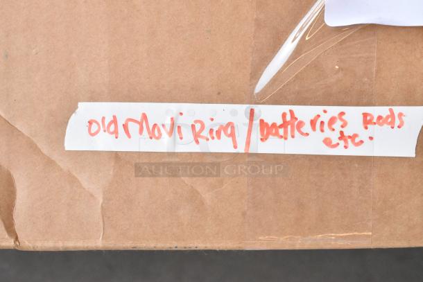 Cardboard box labeled "Old Movi Ring/Batteries rods etc" in red marker.