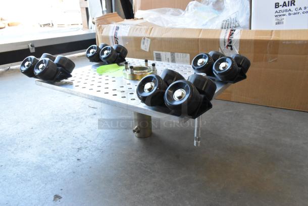 Movi Elevator with eight black wheels on a perforated metal platform, in excellent condition, includes mounting hardware.