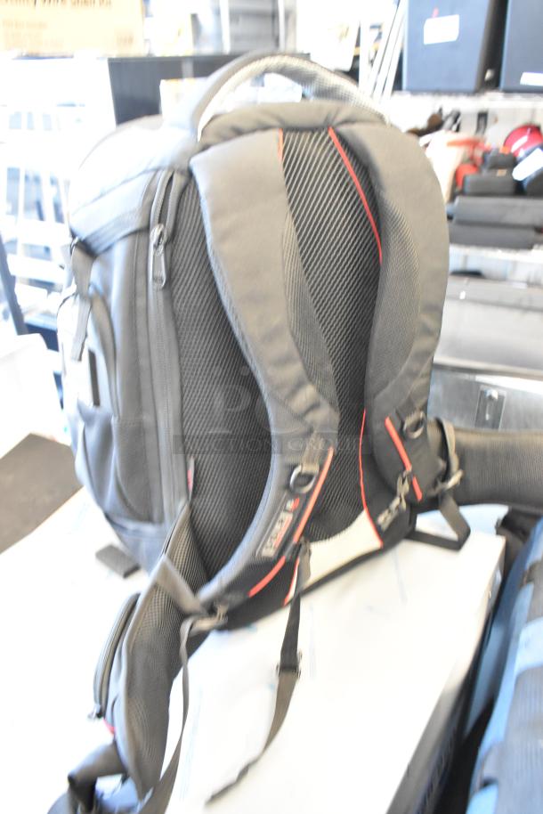 Two various bags, including Petrol and Porta Brace brands, in good condition. Features durable fabric and adjustable straps.