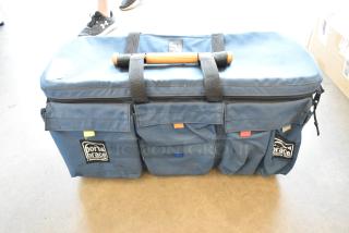 Porta Brace blue bag with Sachtler DV tripod base, features multiple pockets, zipper closure, and carry handle.