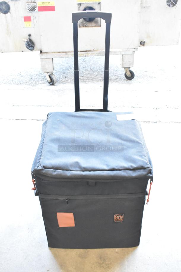 Digi Ignite metal frame in a black rolling bag with a retractable handle. Porta Brace logo visible. Excellent condition.