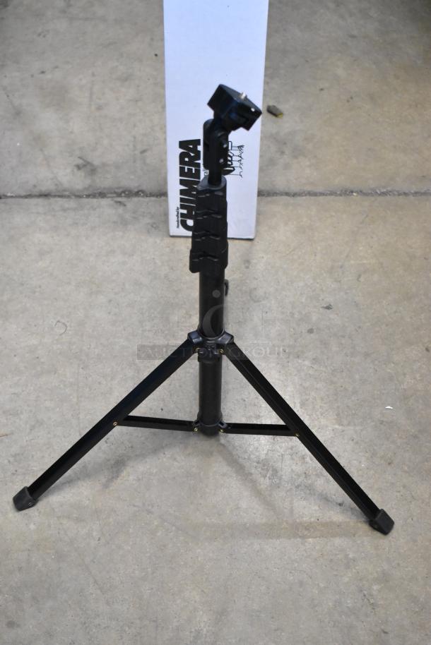 Chimera Tripod, black metal, adjustable legs, sturdy condition. Background shows Chimera branded box.