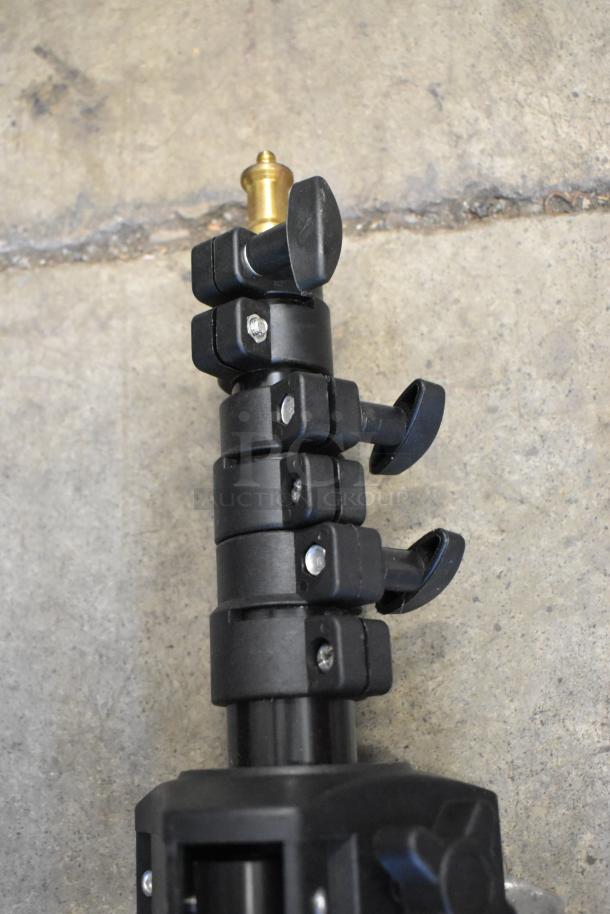 Two Westcott Basics stands with adjustable sections, black finish, metal connectors, in good condition.
