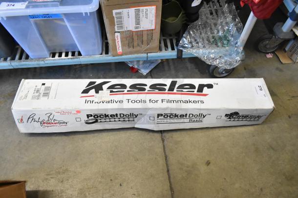 Impact Backdrop Support Kit in a labeled case, showing "Kessler" and other brands. Box shows signs of wear and has shipping labels.