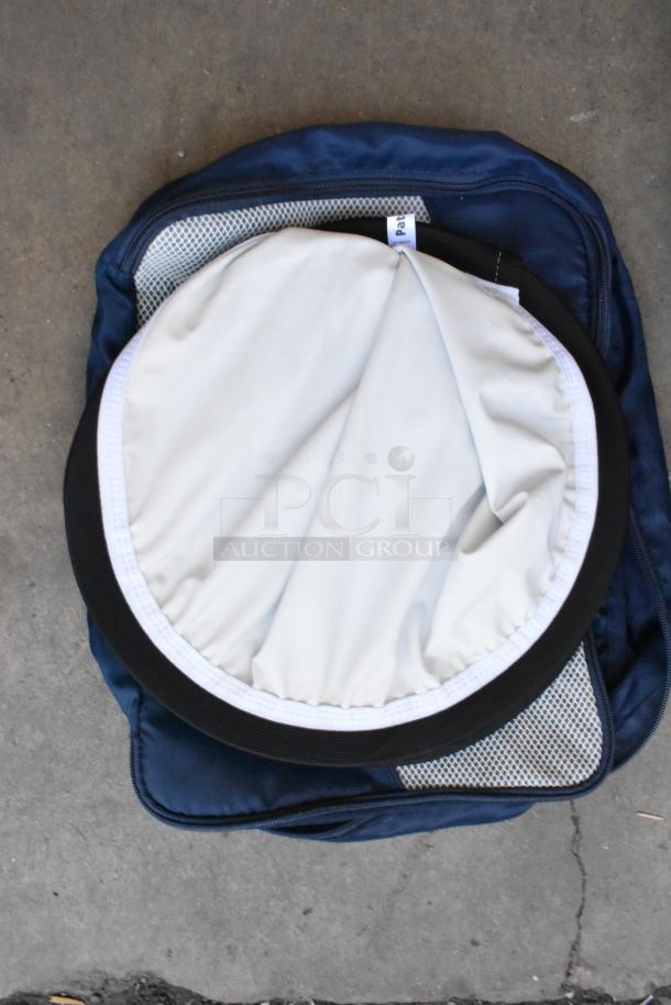 Umbrella and lighting gear with fabric holder, in good condition, featuring mesh pocket and zippered blue case.