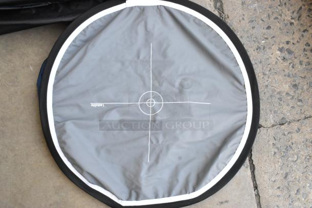 Round fabric holder for lighting gear by Lastolite, featuring a central target print. Excellent condition, white and gray fabric.