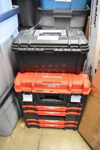 Two toolboxes: a black Husky and a red Craftsman VersaStack with multiple drawers, both in good condition, size 16x9x29.
