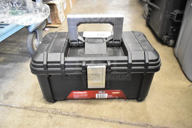 Black Husky toolbox, 16x9x29, with handle and latch, in good condition, labeled. Auction includes another by Craftsman.
