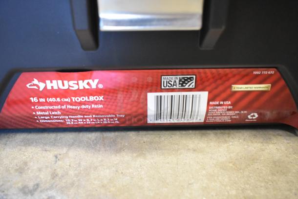 Husky 16" toolbox made of heavy-duty resin with metal latch, removable tray, and large handle. Made in USA, 2-year warranty.