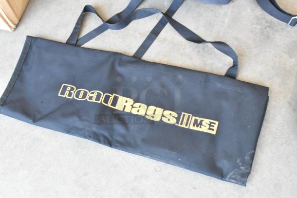 Lot of 4 soft bags featuring "Road Rags II MSE" logo. Black fabric, dual handles, good condition. Ideal for equipment transport.