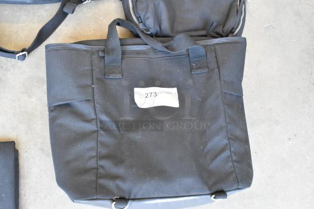 Lot of 4 black soft bags, featuring dual handles, zipper closures, and label showing number 273. Well-used condition.