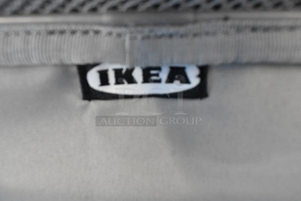 Lot of 4 IKEA soft bags, gray fabric, visible IKEA label, durable condition, ideal for storage and organization.