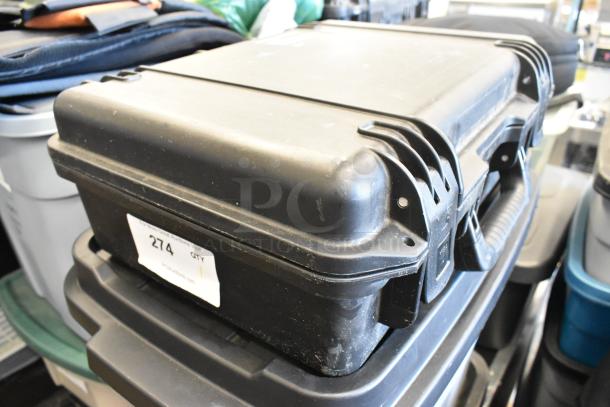 Pelican Storm Case iM2300, black, hard plastic with latch closures, showing minor wear. Label marked "274." Ideal for protective storage.