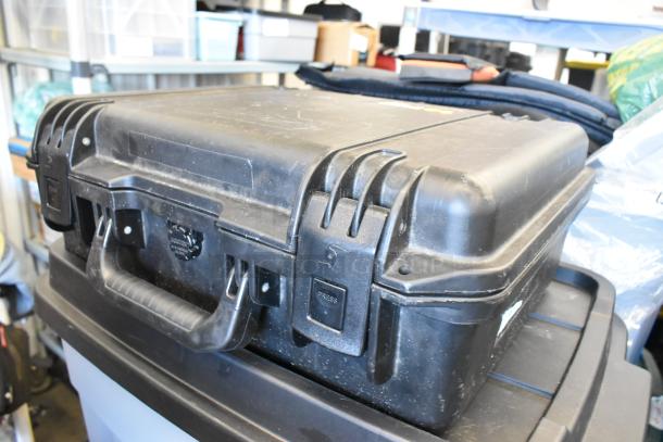 Pelican Storm Case iM2300, black, durable with secure latches, lightly worn. Ideal for protective storage and transport.