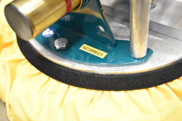 Poly bin with assorted metal pieces, including a teal metal bracket and a bolt with a yellow tag marked "N2388623".