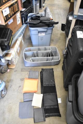 Lot of various items including a Think Tank case insert in a poly bin. Items include fabric pouches and dividers.