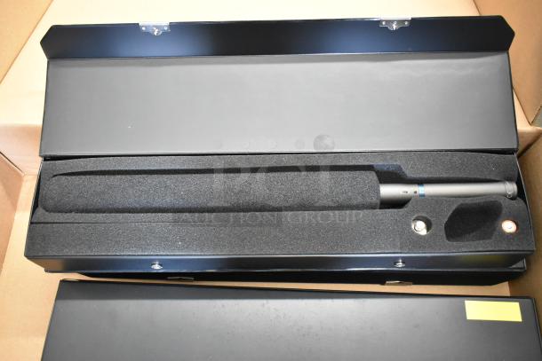 Brand new Audio Technica AT0015 microphone in box, pristine condition, foam-lined case, includes mounting accessories.