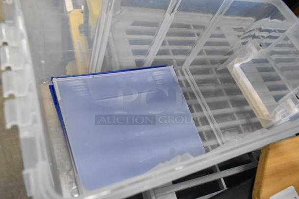 Two clear poly bins with lid, stackable design, used condition, visible interior ribbed structure for strength.