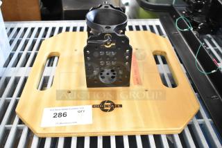 Cinevate wooden plank with metal unit, featuring a central mounting bracket and Cinevate logo. Auction label: 286 QTY.