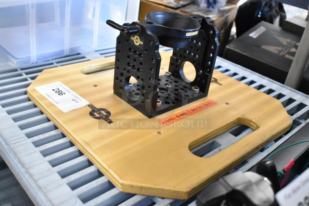Cinevate wooden plank with black metal unit, holes for mounting, Cinevate logo, visible labels, good condition.