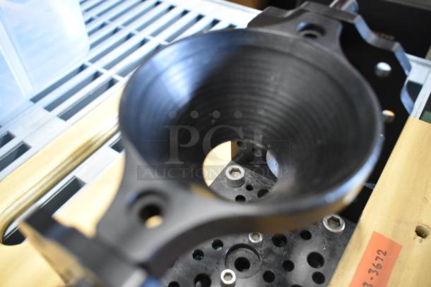 Cinevate wooden plank with metal unit, featuring a black circular holder and perforated base, in good condition.