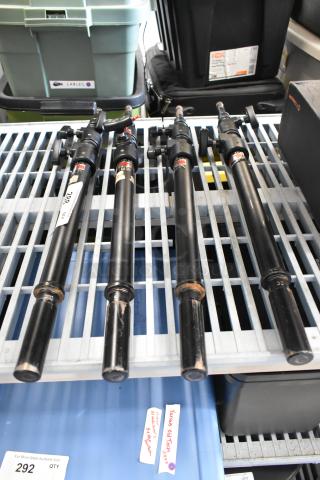 Four Matthews Studio Equipment frame pieces, black, telescopic design, used condition, with visible labels.