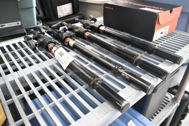 4 Matthews Studio Equipment frame pieces in black, showing moderate wear, labeled as lot 288, on a metal shelf.