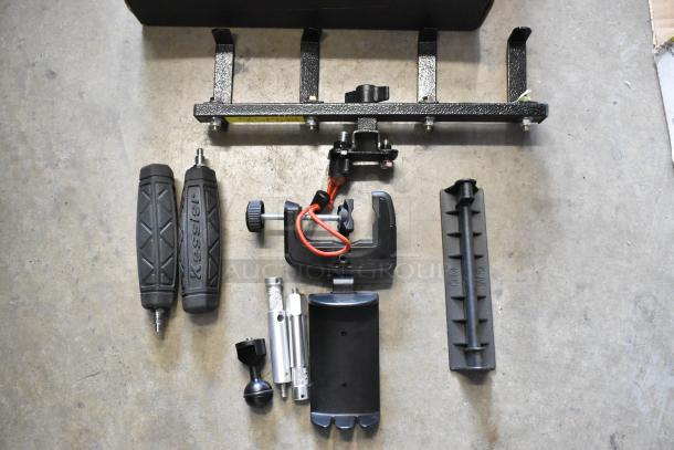 Lot of various camera equipment including Kessler handles, clamps, and brackets. Pre-owned, no visible damage.